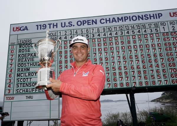 Just champion: Gary Woodland holds aloft the US Open trophy after victory at Pebble Beach. (Picture: AP/Carolyn Kaster)