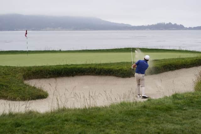 2010 US Open champion and Pete Cowen pupil Graeme McDowell: Hitting out of the bunker on the 18th hole during the final round of the US Open. Picture: AP Photo/David J Phillip