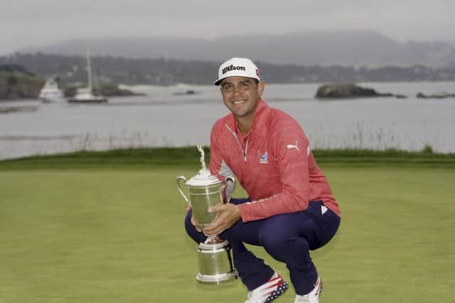 Gary Woodland posses with the trophy after winning the U.S. Open Championship. (AP Photo/Carolyn Kaster)