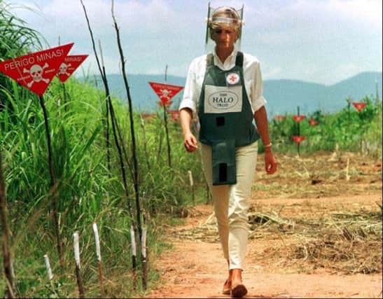 Diana, Princess of Wales walked in one of the safety corridors of the landmine field in Angola on January 15, 1997 during a visit to help a Red Cross campaign outlaw landmines worldwide.   Photo by Jose Manuel Ribeiro/REUTERS