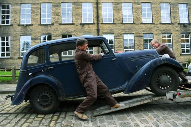 The Jowett 10 arrives at Bradford Industrial Mueum, with the help of the Jowett Car Club's Chris Spencer and Paul Beaumont.
 
Picture: Jonathan Gawthorpe