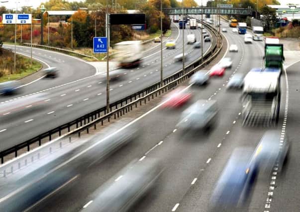 How should motoring and road safety laws be enforced?
