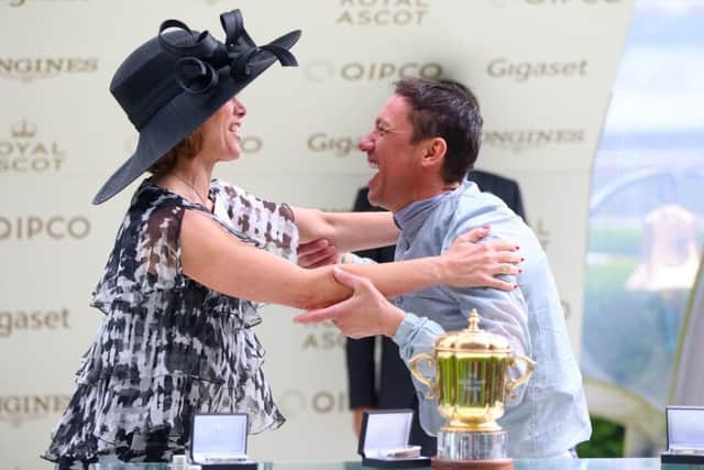 Darcey Bussell (left) presents jockey Frankie Dettori with the trophy for winning the Queen Mary Stakes with Raffle Prize during day two of Royal Ascot. The jockey rides Stradivarius in the Ascot Gold Cup.