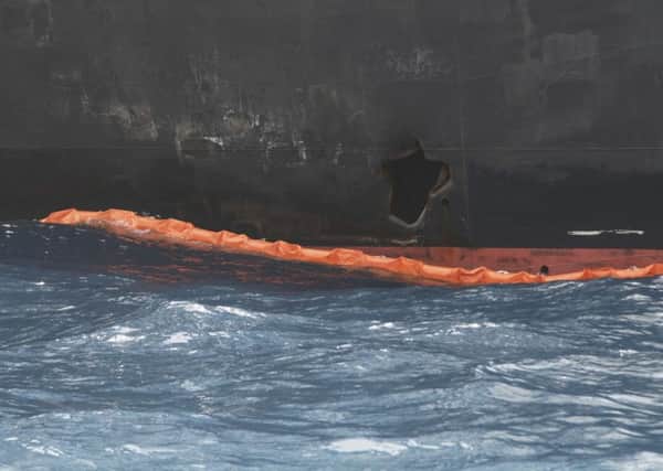 A hole the U.S. Navy says was made by a limpet mine is seen on the damaged Panama-flagged, Japanese owned oil tanker Kokuka Courageous, anchored off Fujairah, United Arab Emirates, during a trip organized by the Navy for journalists, on a Wednesday, June 19, 2019. The limpet mines used to attack the oil tanker near the Strait of Hormuz bore "a striking resemblance" to similar mines displayed by Iran, a U.S. Navy explosives expert said. Iran has denied being involved.