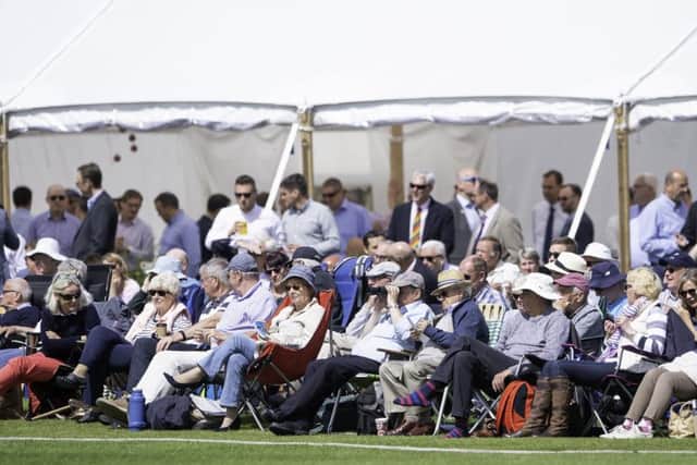 Enjoying the action: Supporters at York Cricket Club's Clifton Park ground for Yorkshire v Warwickshire. Picture: SWPix
