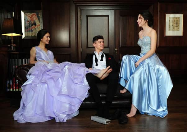 Hannah Slater, left, wears lilac ruffle ball gown with rhinestone waistband, from ý299, Eternity Prom by Eternity Bridal. Harvey Ashford wears: The Britannia tuxedo, ý130; Britannia trousers, ý69; shirt, 325; bow tie, ý10. All at Johnny Tuxedo. Millie Slater wears sweetheart strapless with rhinestone beaded bodice, from ý299, Eternity Prom for Eternity Bridal. At Bowcliffe Hall, Bramham. Picture by Simon Hulme; Styling by Stephanie Smith Hair: Stephanie Fielding and Maria Ricketts at Russell Eaton Hair; Make-up: Ash Fehners, at www.ashfehnersmakeup.format.com/Leeds and Instagram: @ashfehners and @ashfehnersbridalmakeup