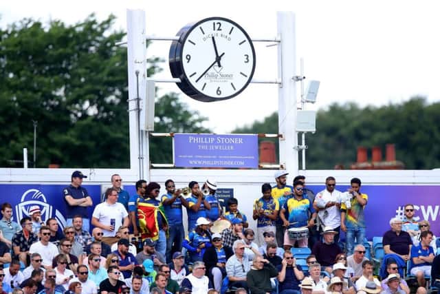 Sri Lanka fans play musical instruments underneath the Dickie Bird clock during the ICC Cricket World Cup group stage match at Headingley