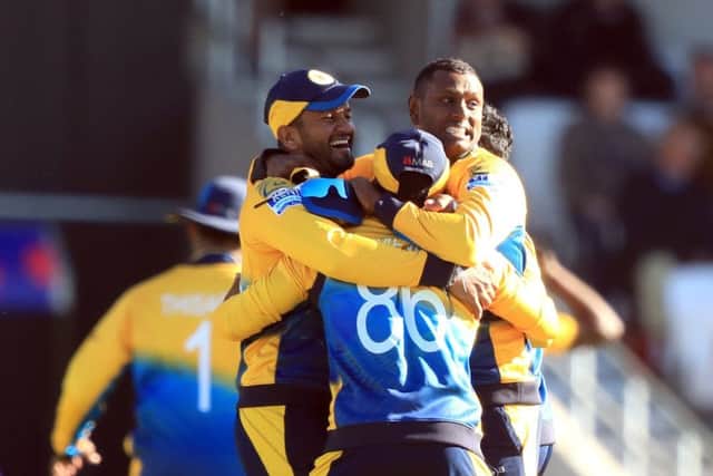 SWEET TASTE OF VICTORY: Sri Lanka players celebrate winning by 20 runs at Headingley. Picture: Simon Cooper/PA