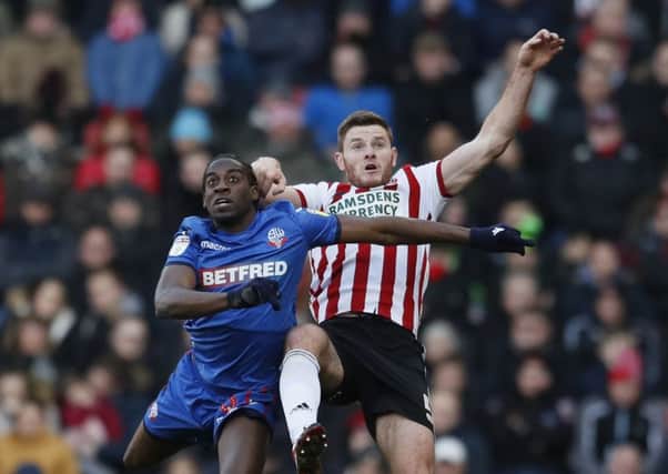 Clayton Donaldson, in action for Bolton Wanderagainst former Sheffield United team-mate, Jack O'Connell in February this year. Picture: Simon Bellis/Sportimage