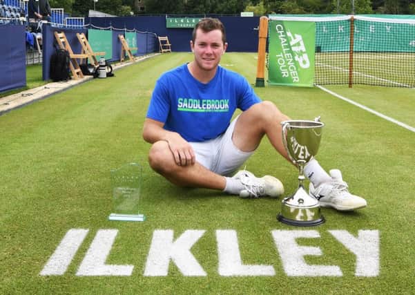 Dominik Koepfer poses with the trophy after his men's final match against Dennis Novak at the Ilkley Trophy. (Photo by George Wood/Getty Images)