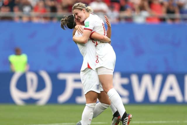 England's Ellen White (right) celebrates scoring her side's second goal against Cameroon in Valenciennes.. Picture: Richard Sellers/PA