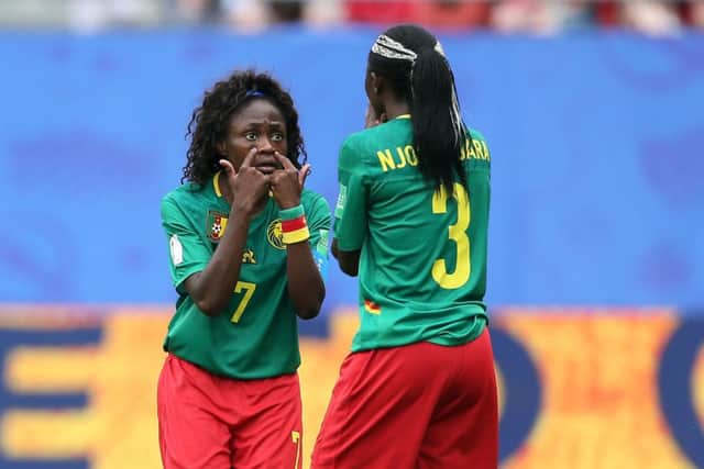 Cameroon's Gabrielle Aboudi Onguene (left) and Ajara Nchout show their frustration in Valenciennes on Sunday. Picture: Richard Sellers/PA