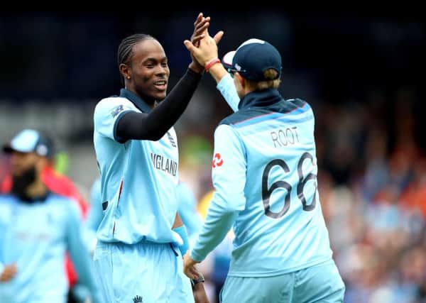 England's Jofra Archer (left) celebrates with Joe Root after taking the wicket of Sri Lanka's Dhananjaya de Silva at Headingley. Picture: Tim Goode/PA