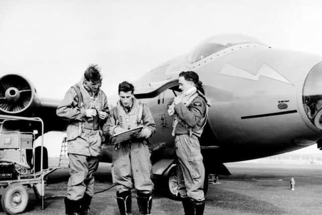 A crew from 12 Squadron based at RAF Binbrook in Lincolnshire check their briefing on 23 September 1952
