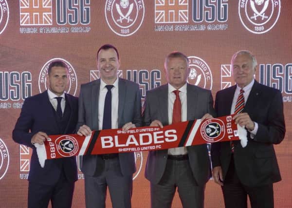 Sheffield Uniteds Kevin McCabe, Billy Sharp and Chris Wilder with USGs Shay Zakhaim at Bramall Lane to reveal the Blades new shirt sponsor. Picture: Scott Merrylees