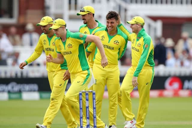Australia's Marcus Stoinis (second right) celebrates taking the wicket of England's Jos Buttler, caught by Australia's Usman Khawaja. Picture: Tim Goode/PA
