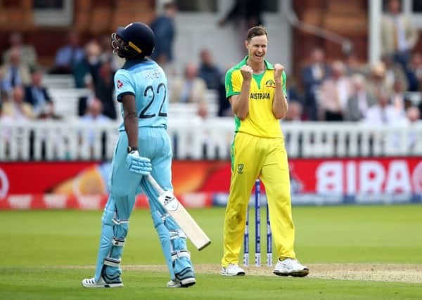 Australia's Jason Behrendorff celebrates taking the wicket of England's Jofra Archer (left), caught by David Warner at Lord's. Picture: Tim Goode/PA