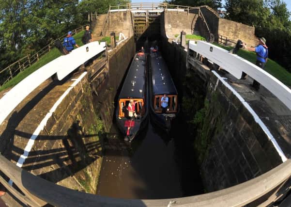 Boats pass through the iconic Five Rise Locks at Bingley - but the state of the surrounding area has been criticised.