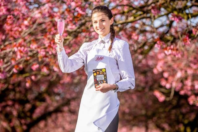 Thursday 3rd May  2018, Harrogate 
Picture Credit Charlotte Graham

Picture Shows Bettys' waitress Chelsea Hudson under Harrogate's famous blossoms.