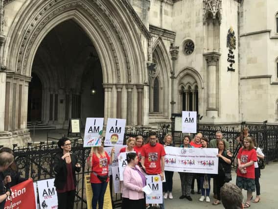 Campaigners gathered outside the Royal Courts of Justice ahead of the landmark legal challenge against the Government over special educational needs funding. Picture by Sian Harrison/PA Wire.