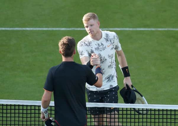 Kyle Edmund (top) shakes hands with Cameron Norrie.