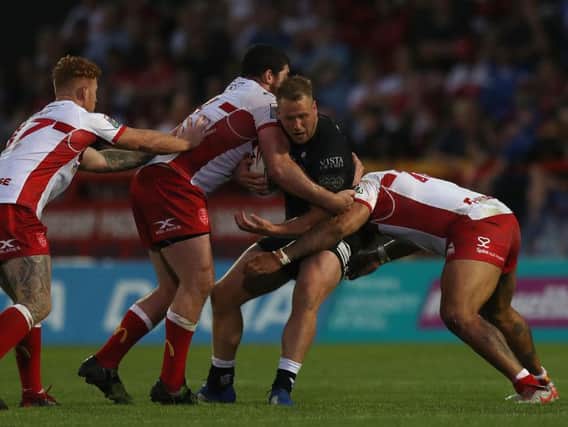 Hull FC's Joe Westerman takes the ball in against Hull KR - just moments before dislocating his knee.(Simon Cooper/PA Wire)