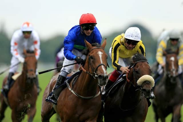Tim Easterby's one-time St Leger hopeful Wells Farhh Go (red cap0 makes his comeback at Newmarket in the Fred Archer Stakes.