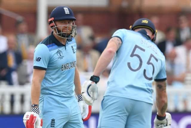 England's Jonny Bairstow. left, gestures as he speaks with teammate Ben Stokes during the 2019 Cricket World Cup group stage match between England and Australia at Lord's Cricket Ground in London on June 25, 2019. (Picture: SAEED KHAN/AFP/Getty Images)