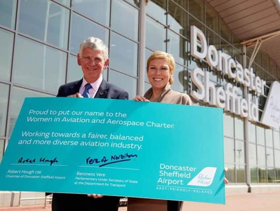 Robert Hough, chair of Peel Group & DSA, and Baroness Vere with their signed pledge to encourage more women to work in aviation