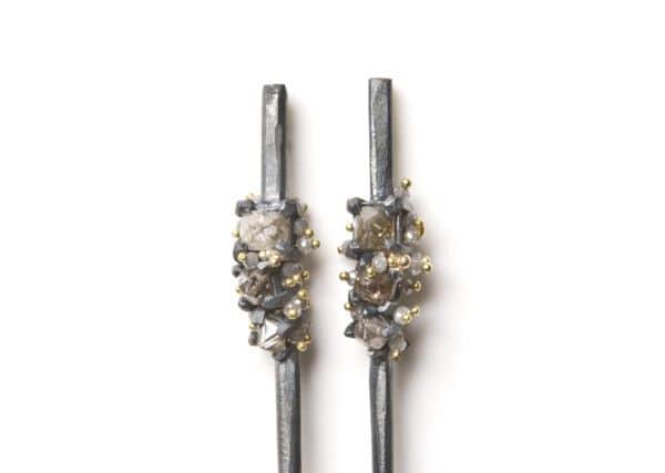 Oxidized silver, 18ct gold earrings set with octahedron,natural diamonds and brilliant white diamonds, £1,600.