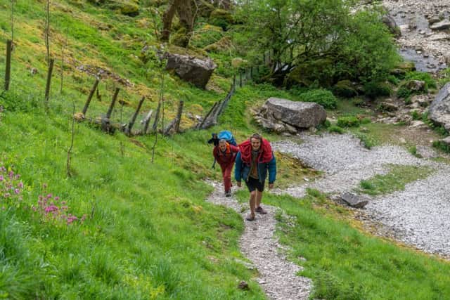Date: 10th May 2019.
Pivcture James Hardisty.
Climbing feature at one of the UK's best climbing walls Malham Cove, in the heart of the Yorkshire Dales, near Skipton. Pictured Sport climbers Steve McClure, and Haydn Jones, (correct) making there way along the stoney path up to Malham Cove.