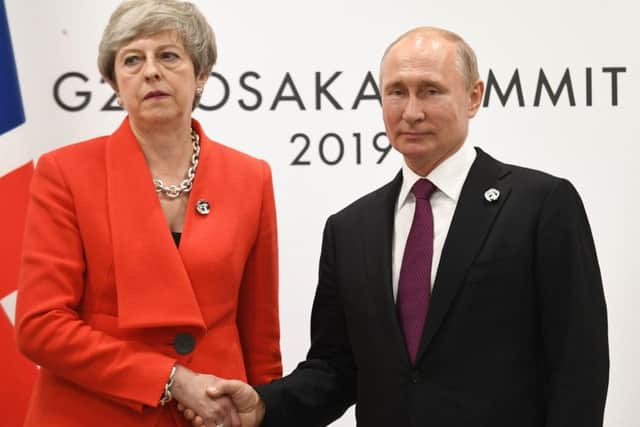 Theresa May was stony-faced when she met Russian leader Vladimir Putin at the G20 summit.