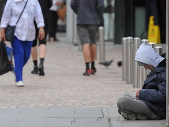 The partnership says giving to beggars can help fund drug habits