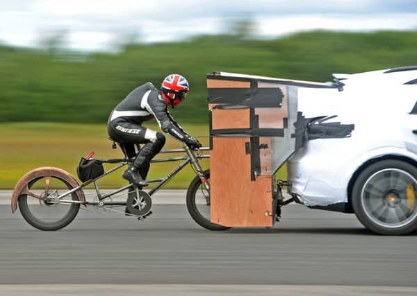 Cyclist Neil Campbell training and equipment testing for an attempt to break the 167mph world cycling speed record at Elvington, Airfield, Yorks. Picture Tony Johnson.