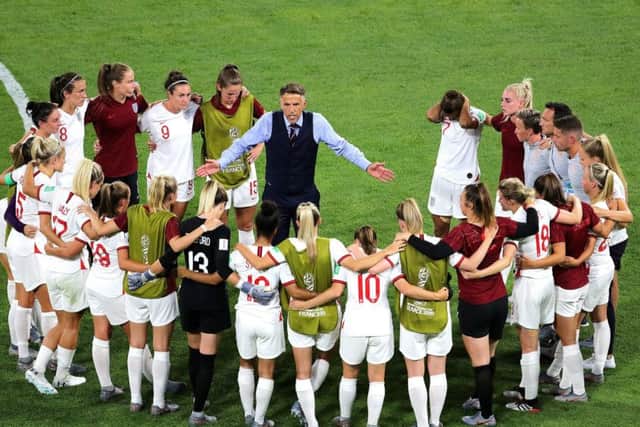 England head coach Phil Neville (centre) talks to the players after the final whistle in Lyon. Picture: Richard Sellers/PA
