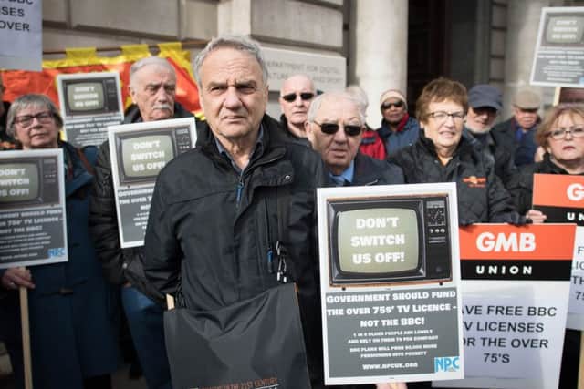 Members of the National Pensioners Convention (NPC) protest in Westminster at the Government's decision to pass responsibility for funding the TV licence for over-75s onto the BBC.