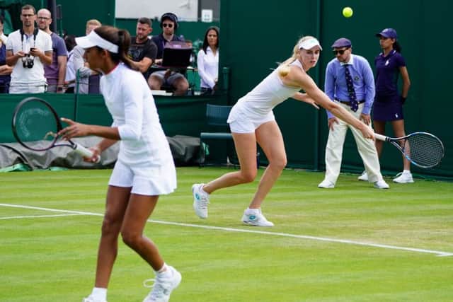 Naomi Broady (right) and Naiktha Bains (left) in action during the women's doubles on day three of the Wimbledon Championships (Picture: Adam Davy/PA Wire)