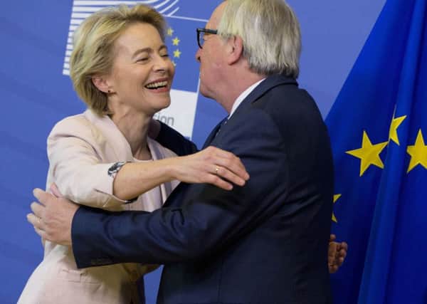 Germany's Ursula von der Leyen is welcomed by European Commission President Jean-Claude Juncker prior to a meeting at EU headquarters in Brussels.  European Union leaders have nominated Germany's Ursula von der Leyen to become the next president of the European Commission.