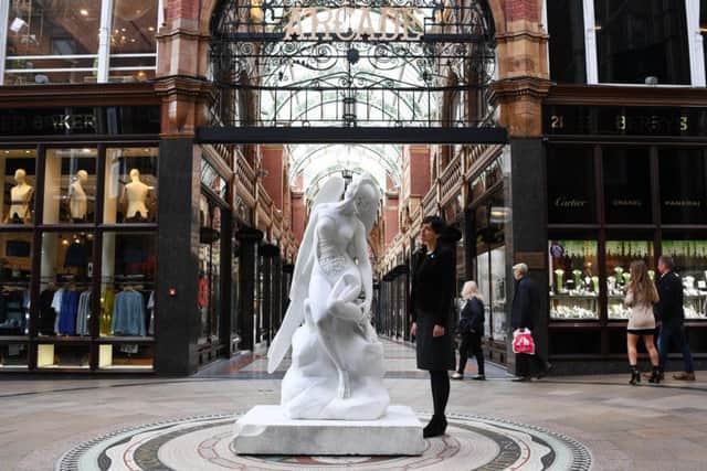 Producer of Yorkshire Sculpture International Jane Bhoyroo with Anatomy of an Angel, on display in the Victoria Quarter arcade, part of Yorkshire Sculpture International.