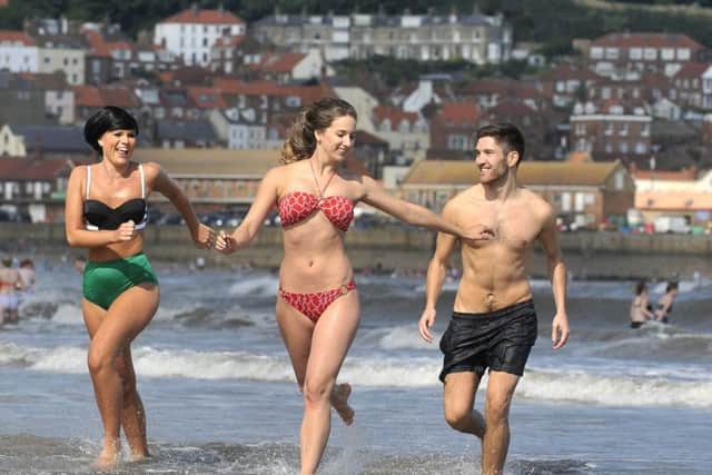 Summer holidays in sun kissed Scarborough .Emily Taylor , Becky Lumb, Patrick Eaton have fun. pic Richard Ponter 153410a