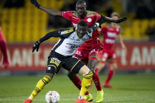 Lokeren's Bambo Diaby and Essevee's Ibrahima Seck fight for the ball during a soccer match between Sporting Lokeren and SV Zulte Waregem in January. Picture: JASPER JACOBS/Getty Images.
