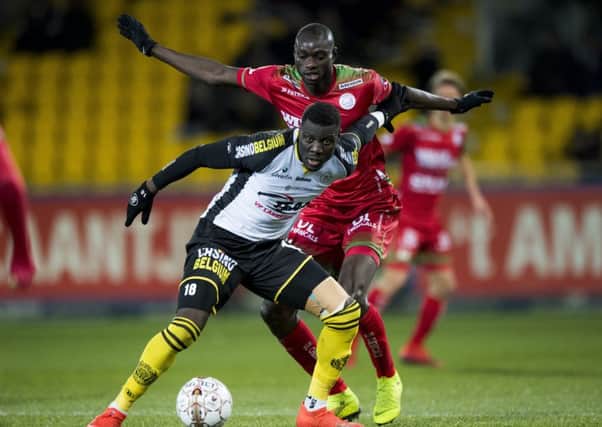 Lokeren's Bambo Diaby and Essevee's Ibrahima Seck fight for the ball during a soccer match between Sporting Lokeren and SV Zulte Waregem in January. Picture: JASPER JACOBS/Getty Images.