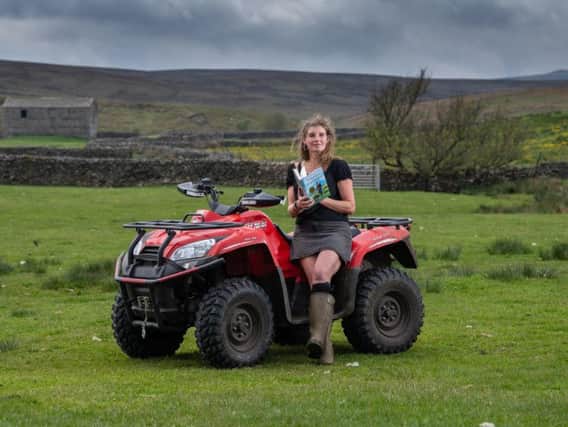 Amanda Owen on one of the family's quad bikes. The stolen vehicle is a green Yamaha Grizzly 700