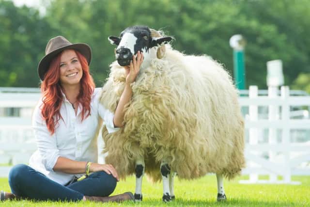 The Red Shepherdess Hannah Jackson with a Westmorland Rough Fell at the Great Yorkshire Show.  Photography by Richard Walker