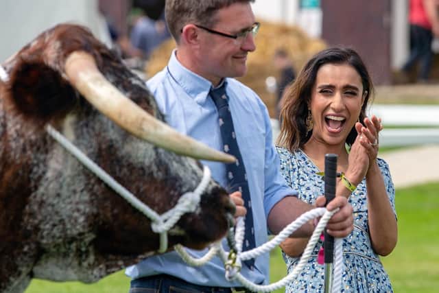 Anita Rani reacts with a Longhorn belonging to James Emsley and Michael Cleasby from Scarborough. Picture by Bruce Rollinson.