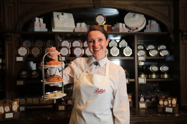 Bettys Craft Bakery, Harrogate. Following the life of a Fat Rascal from the bakery to Bettys Cafe Tea Rooms in Harrogate. Pictured is staff member Joanne Smith with a tray of Fat Rascal at the Cafe Tea Rooms. Picture: Chris Etchells