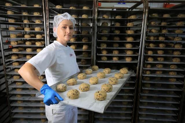 Bettys Craft Bakery, Harrogate. Following the life of a Fat Rascal from the bakery to Bettys Cafe Tea Rooms in Harrogate. Pictured is Fran Murphy with a tray of Fat Rascals ready for the oven. Picture: Chris Etchells