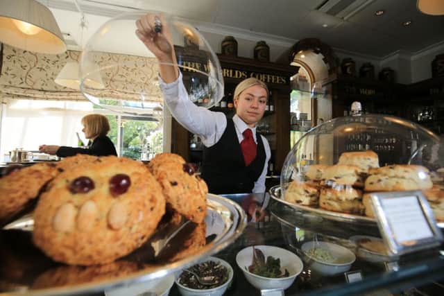 Bettys Craft Bakery, Harrogate. Following the life of a Fat Rascal from the bakery to Bettys Cafe Tea Rooms in Harrogate. Pictured is staff member Chrisie Deprez with a tray of Fat Rascal at the Cafe Tea Rooms. Picture: Chris Etchells