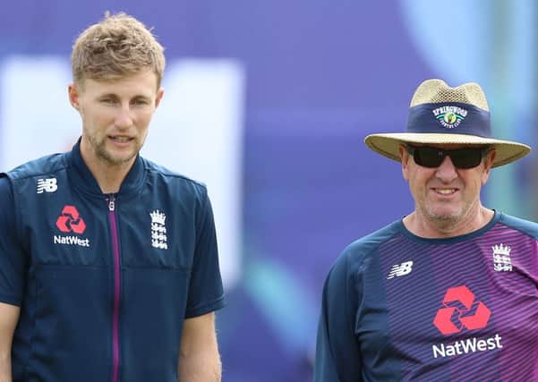 England's Joe Root (left) and head coach Trevor Bayliss. Picture: Nigel French/PA