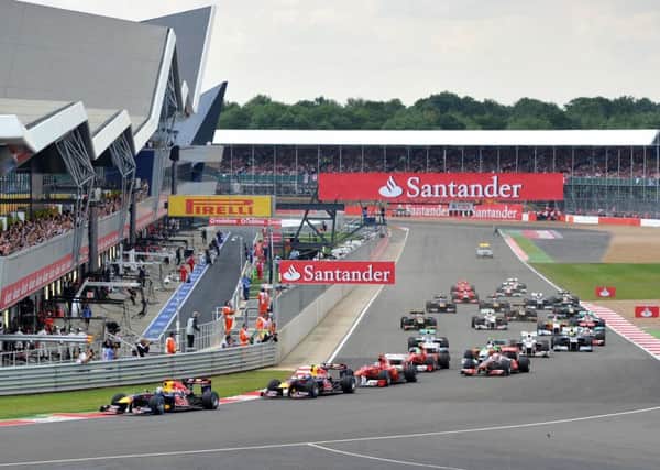 STICKING WITH TRADITION: Cars round the first corner during the Formula One Santander British Grand Prix at Silverstone in July 2011. Picture: Martin Rickett/PA Wire.